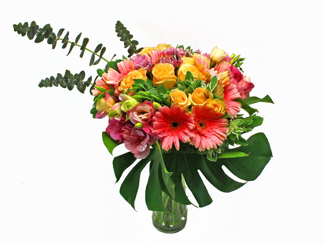 Arrangement of Champagne Rose Pink Gebera Lilies and matching flowers in a 